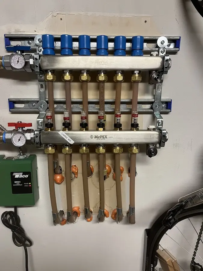 Plumber performing Water Heater Repair at a residential property in Schroeppel